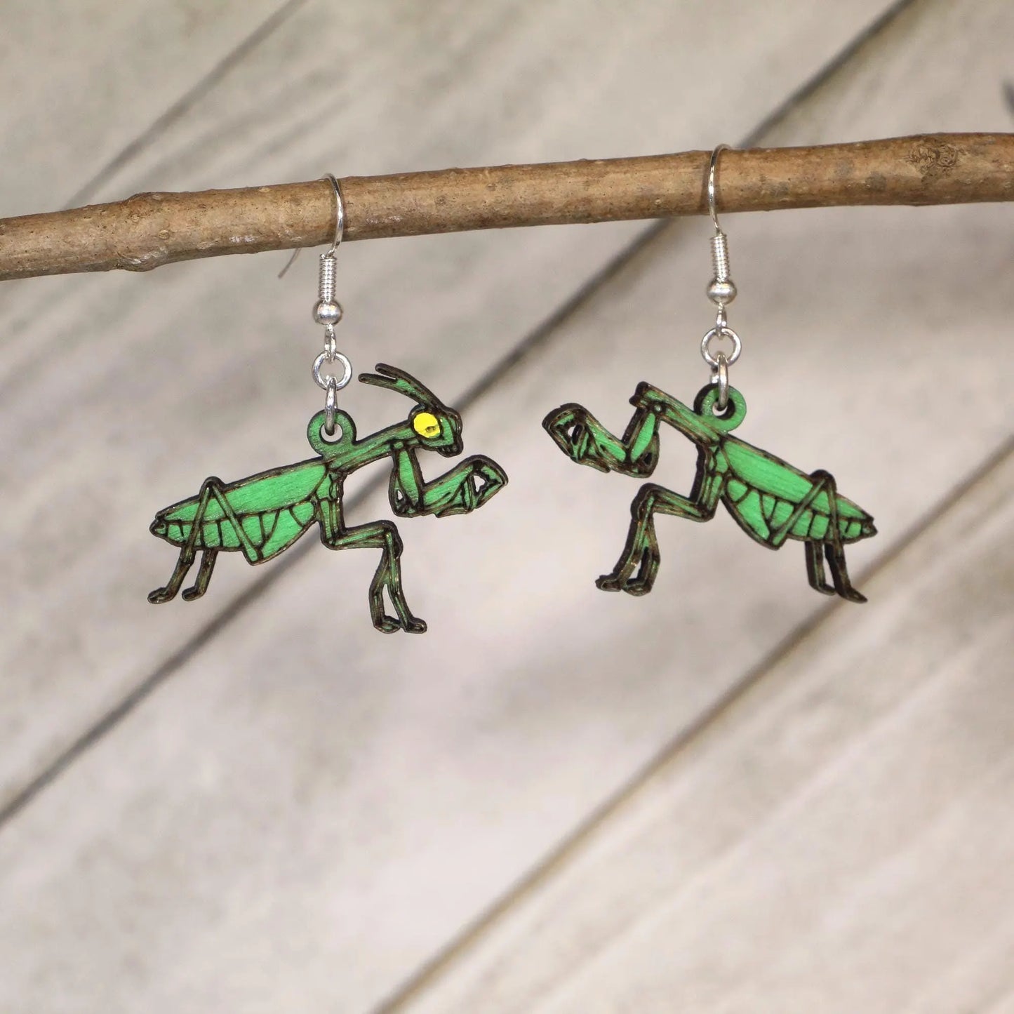 Hand-painted wooden praying mantis dangle earrings featuring realistic male and female mantis design with hypoallergenic sterling silver hooks, entomology insect jewelry gift for bug lovers
