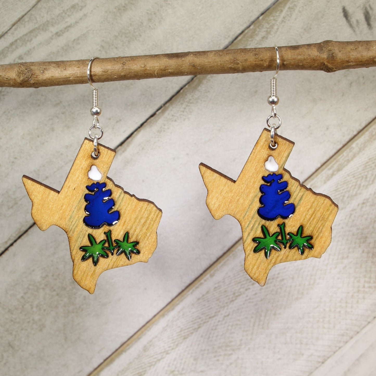 Hand-painted wooden and resin Texas bluebonnet dangle earrings with vibrant wildflower design and hypoallergenic sterling silver hooks, lightweight state pride jewelry for Texas lovers and nature fans