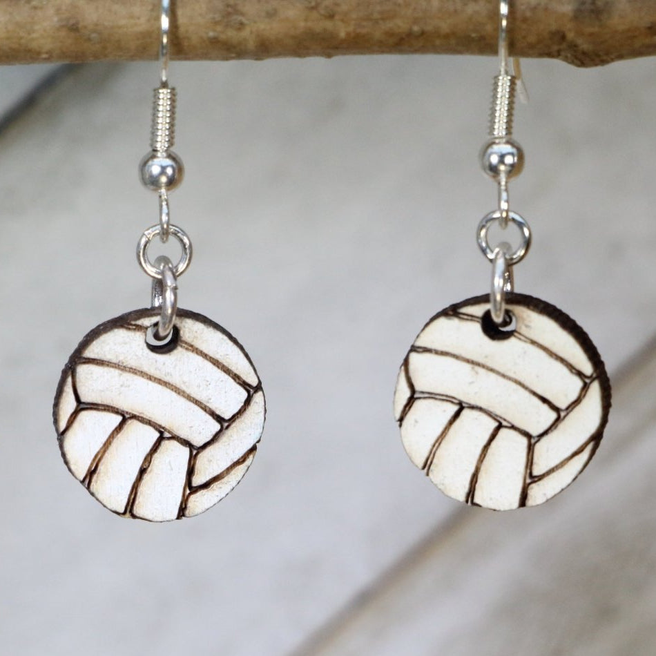 Hand-painted wooden volleyball dangle earrings featuring a detailed ball design with classic panel lines and sporty styling and hypoallergenic sterling silver hooks, lightweight jewelry for volleyball players and sports enthusiasts by Cate’s Concepts
