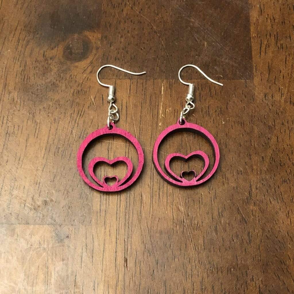 Hand-painted wooden growing heart dangle earrings featuring a layered expanding heart design with flowing lines and hypoallergenic sterling silver hooks, lightweight jewelry for romantic gifts and love-inspired style by Cate’s Concepts