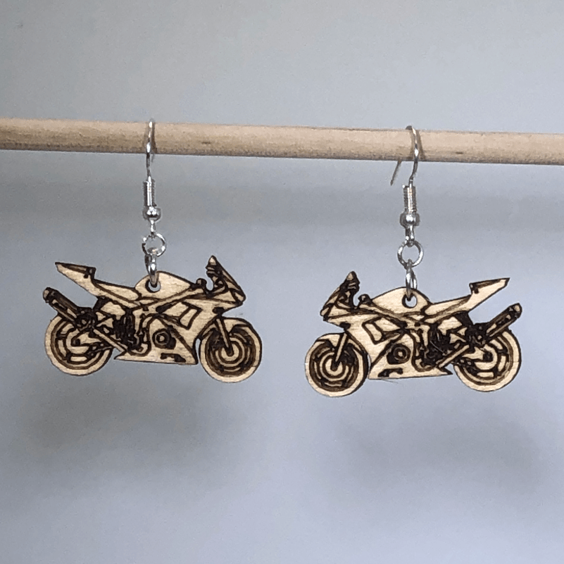 Hand-painted wooden motorcycle dangle earrings featuring a detailed bike silhouette with wheels and handlebars and hypoallergenic sterling silver hooks, lightweight jewelry for bikers and motorcycle enthusiasts by Cate’s Concepts