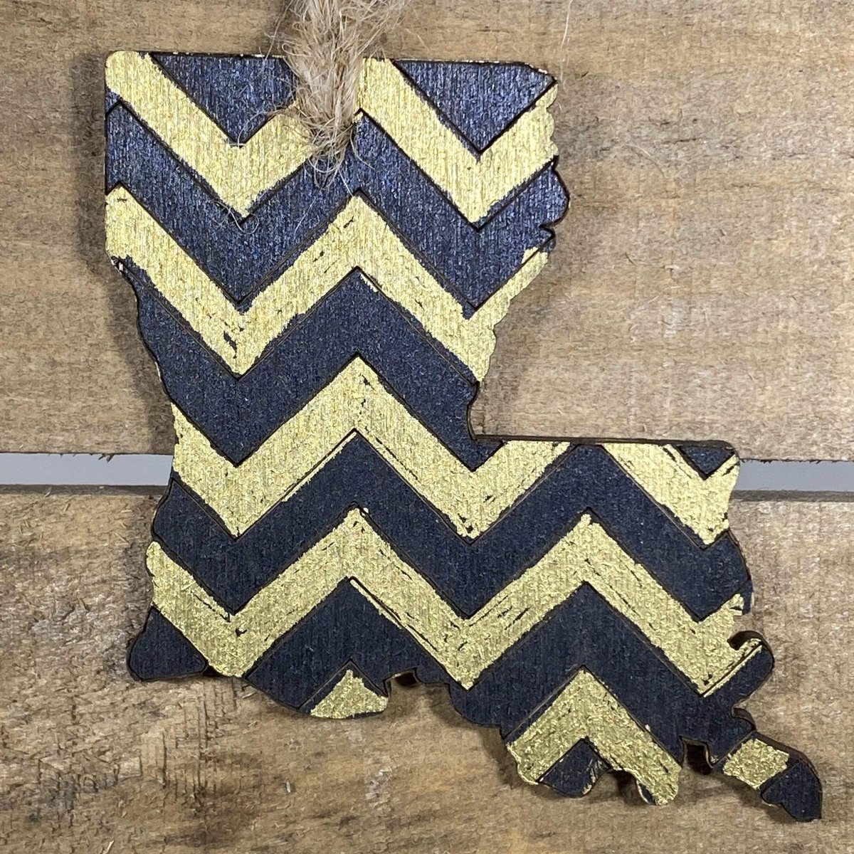 Hand-painted wooden New Orleans Christmas ornament featuring a bold black and gold design with city-inspired flair, festive holiday decor for Louisiana locals and New Orleans pride enthusiasts by Cate’s Concepts
