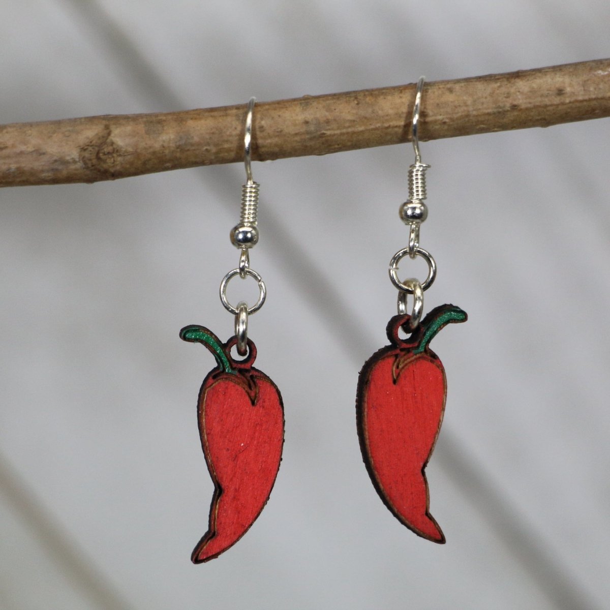 Hand-painted wooden red chili pepper dangle earrings with spicy food design and hypoallergenic sterling silver hooks, lightweight chili pepper statement jewelry earrings for food lovers and bold style