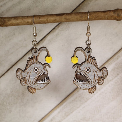 Hand-painted wooden anglerfish dangle earrings with deep sea ocean creature design and hypoallergenic sterling silver hooks, quirky marine life statement jewelry earrings