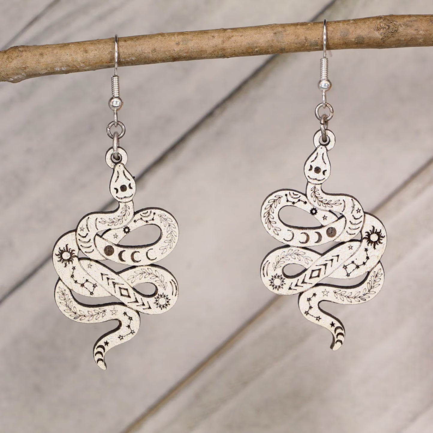 Hand-painted celestial snake wooden dangle earrings with moon phase and mystical design, lightweight hypoallergenic jewelry for boho style, spiritual lovers, and astrology fans