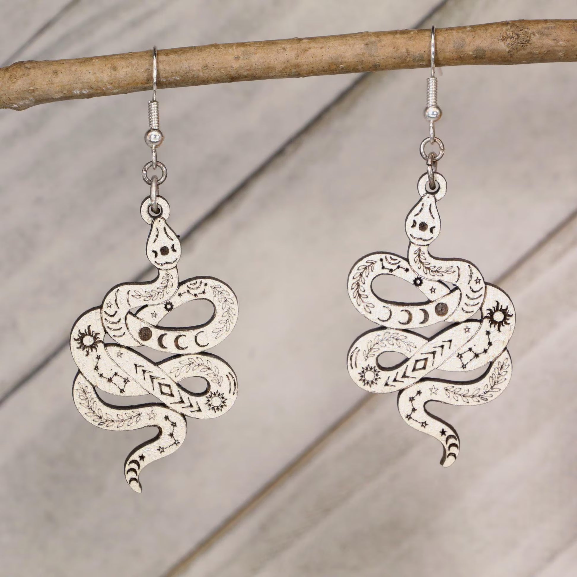 Hand-painted celestial snake wooden dangle earrings with moon phase and mystical design, lightweight hypoallergenic jewelry for boho style, spiritual lovers, and astrology fans