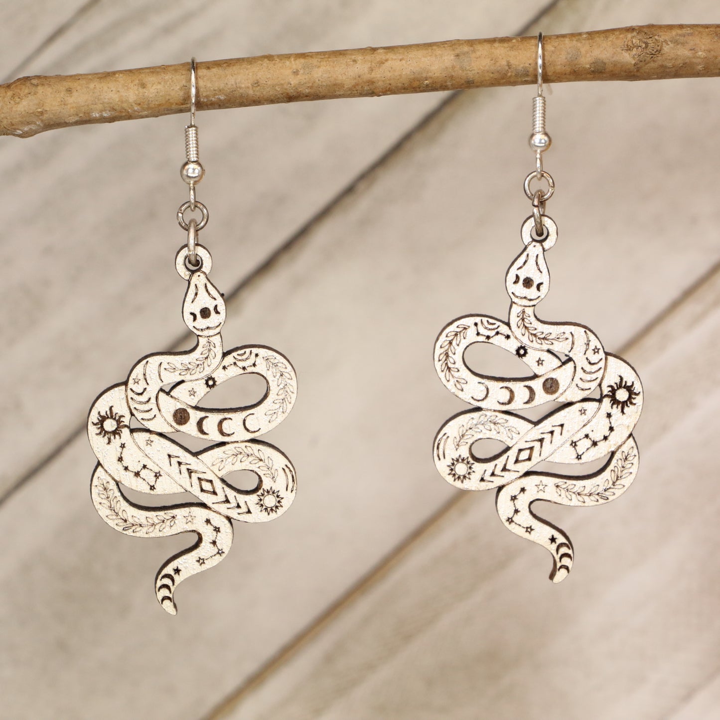 Hand-painted celestial snake wooden dangle earrings with moon phase and mystical design, lightweight hypoallergenic jewelry for boho style, spiritual lovers, and astrology fans
