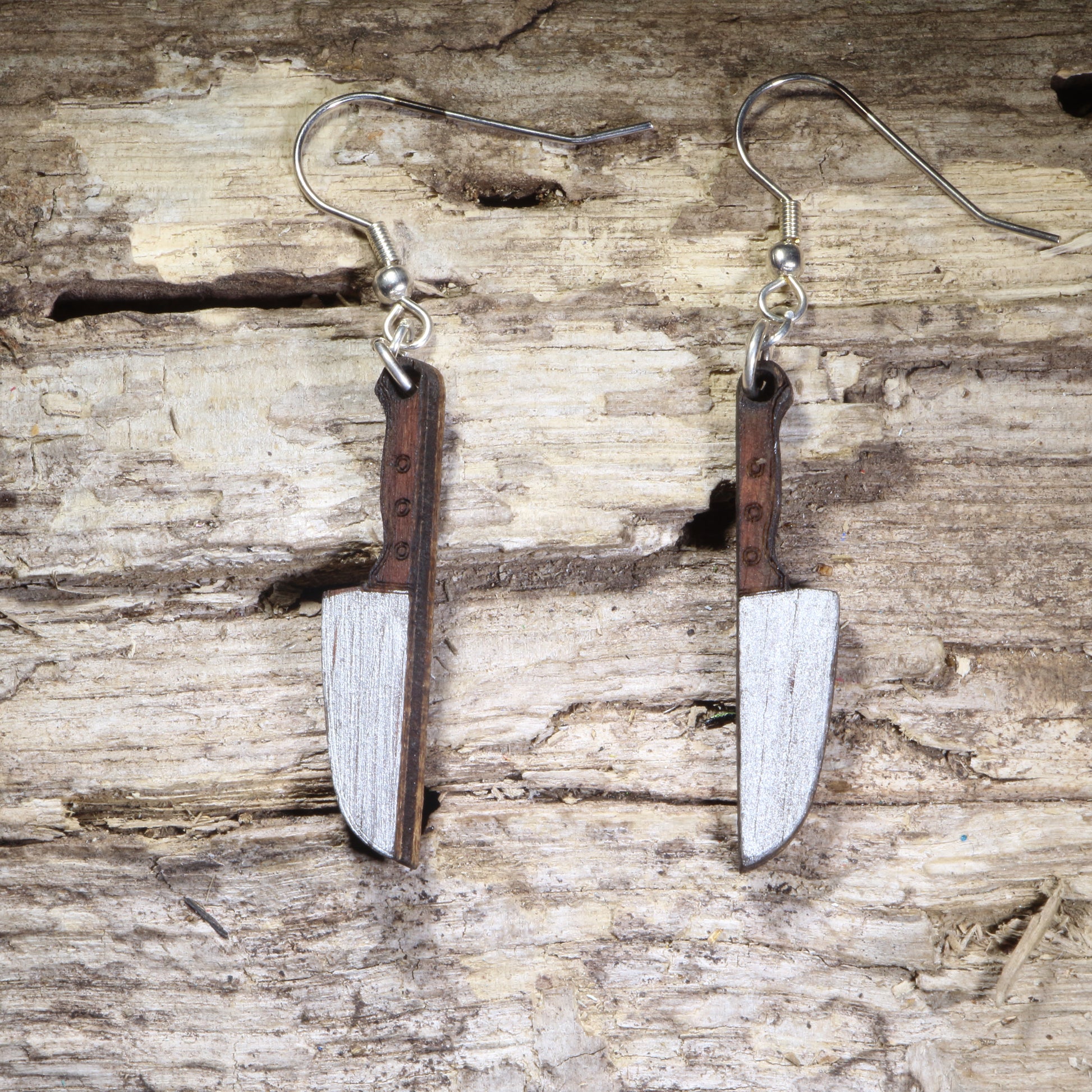 Handcrafted chef's knife wooden dangle earrings featuring detailed kitchen knife designs with realistic engraved blade accents. Lightweight laser-cut wooden earrings with hypoallergenic .925 sterling silver hooks, perfect for chefs, cooks, culinary students, bakers, food lovers, restaurant professionals, and unique kitchen-inspired jewelry.