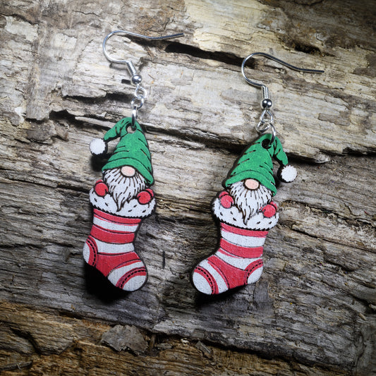 Hand-painted Christmas gnome wooden dangle earrings featuring a whimsical holiday gnome design, lightweight festive jewelry for Christmas parties, gnome lovers, winter outfits, and holiday gift giving.