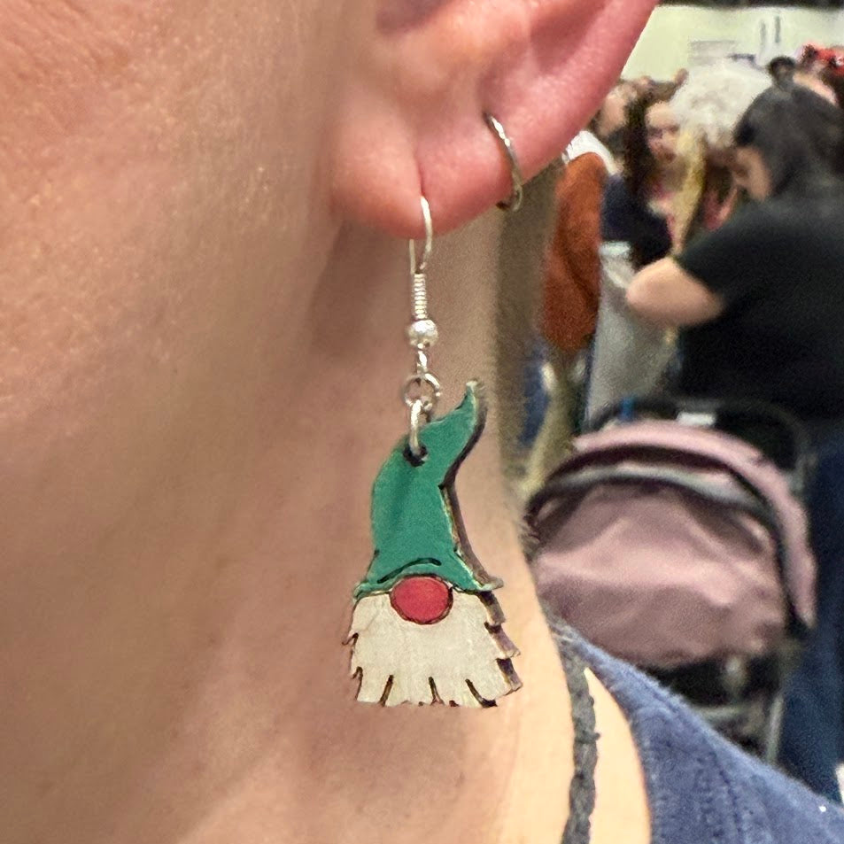 Close-up of hand-paintedGarden Gnome Wooden Dangle Earrings | Whimsical Nature Jewelry Gift with hypoallergenic silver hooks, whimsical holiday jewelry by Cate’s Concepts