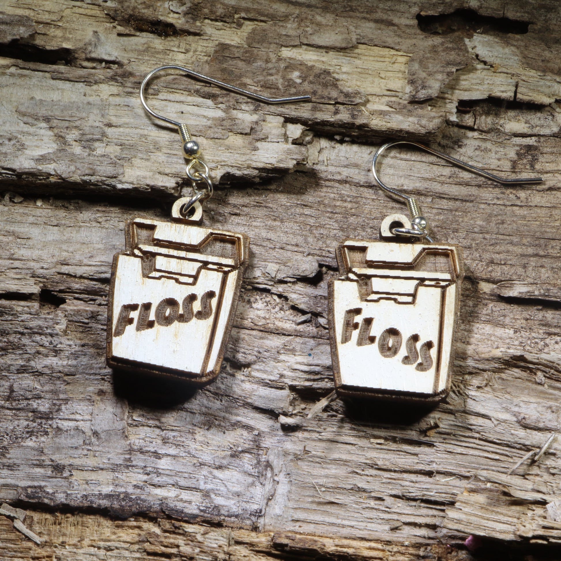 Hand-painted wooden dental floss dangle earrings on hypoallergenic .925 sterling silver hooks. Lightweight dental hygiene jewelry for dentists, dental hygienists, dental assistants, orthodontists, and oral health professionals.