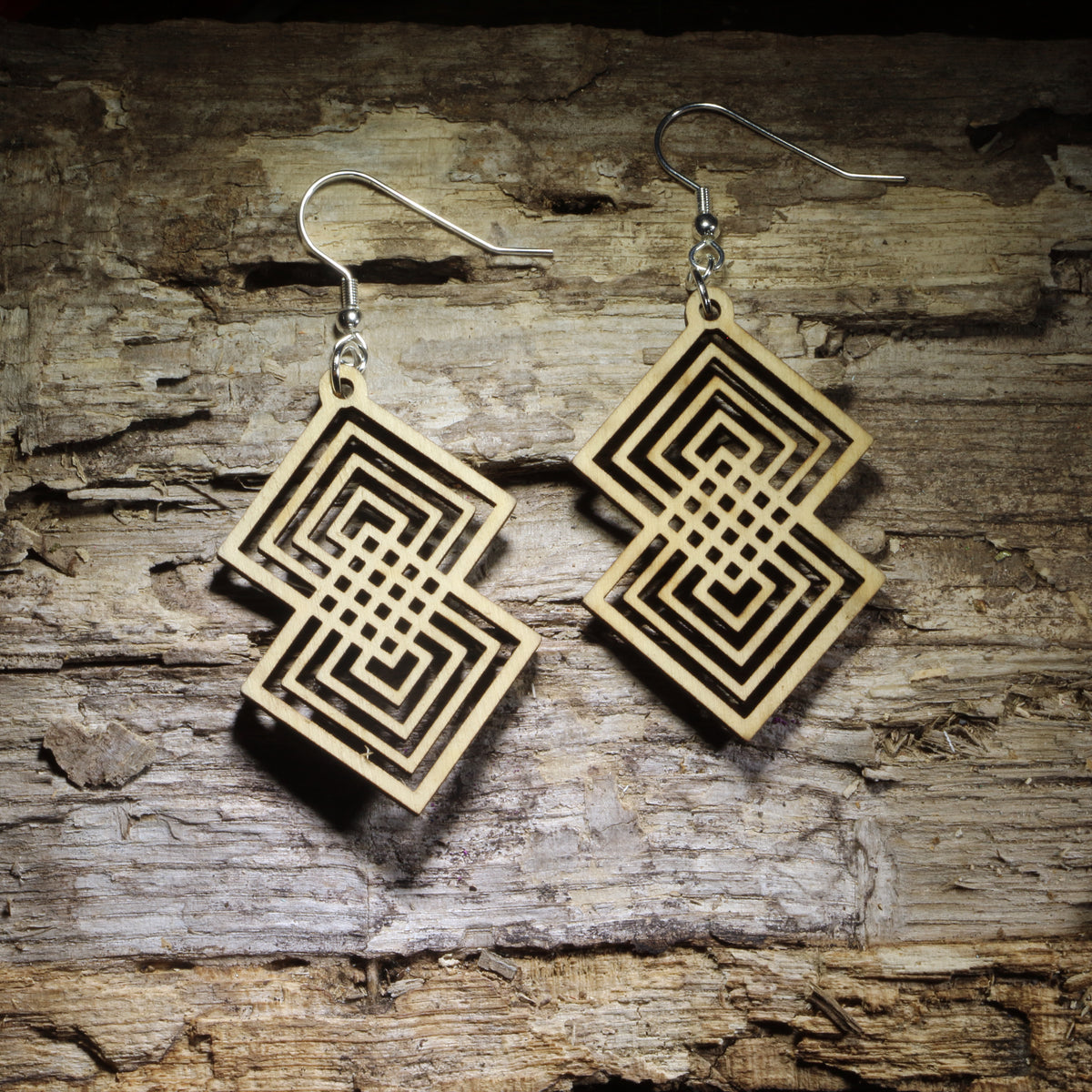 Intterlocking Double diamond geometric wooden dangle earrings featuring an intricate interlocking square pattern and natural wood finish. Lightweight statement jewelry perfect for geometric art lovers, modern style, and unique gifts.