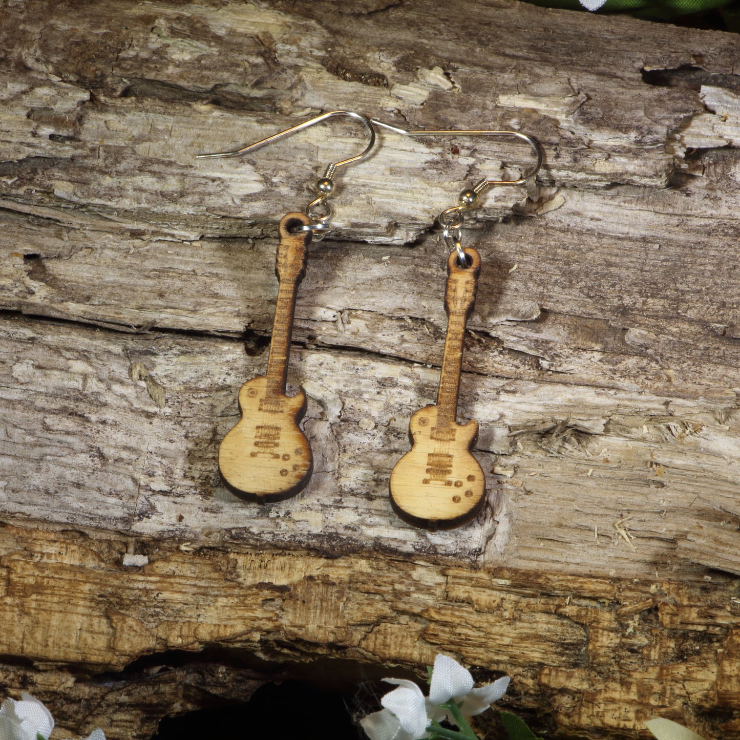 Hand-painted wooden electric guitar dangle earrings featuring detailed electric guitar silhouettes, hypoallergenic sterling silver hooks, and lightweight musician jewelry for guitar players, rock music fans, and band enthusiasts by Cate's Concepts.