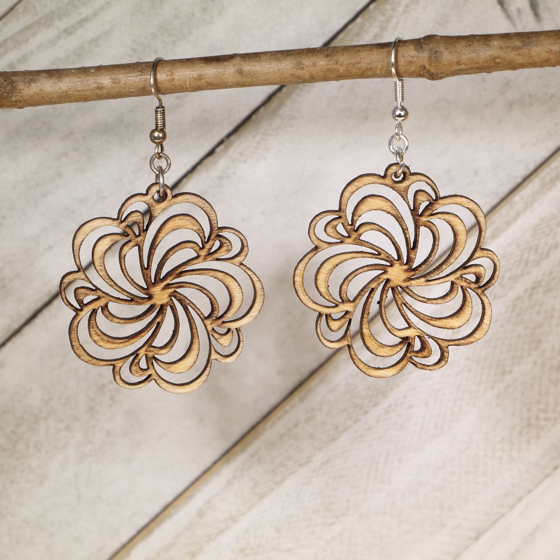 Hand-painted wooden floral swirl dangle earrings with intricate boho filigree design and hypoallergenic sterling silver hooks, lightweight flower statement jewelry for nature lovers and festival style