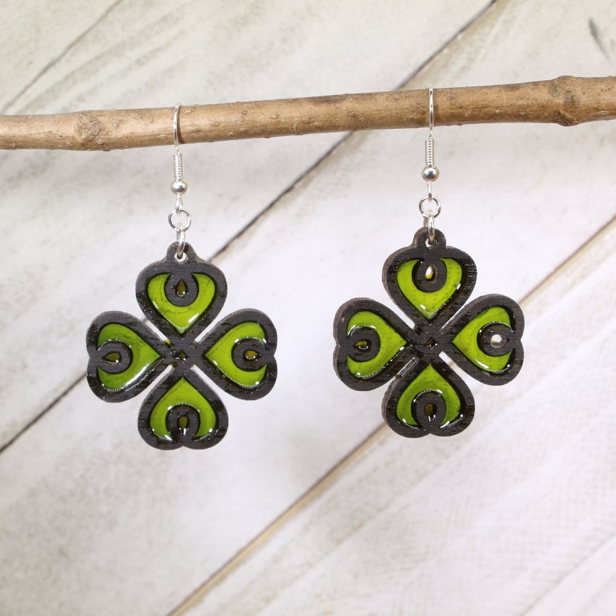 Hand-painted wood and resin four leaf clover dangle earrings with lucky Irish charm design and hypoallergenic sterling silver hooks, lightweight clover statement jewelry earrings for St. Patrick’s Day and good luck style