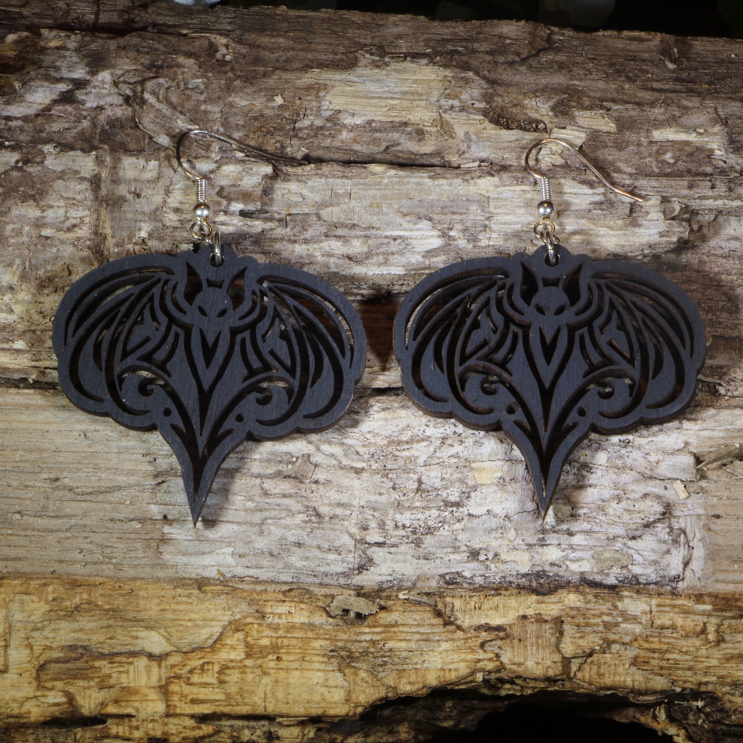 Hand-painted wooden gothic bat dangle earrings featuring an elegant bat silhouette with intricate details, hypoallergenic sterling silver hooks, and lightweight gothic Halloween jewelry for bat lovers, spooky season fans, and alternative fashion enthusiasts by Cate's Concepts.