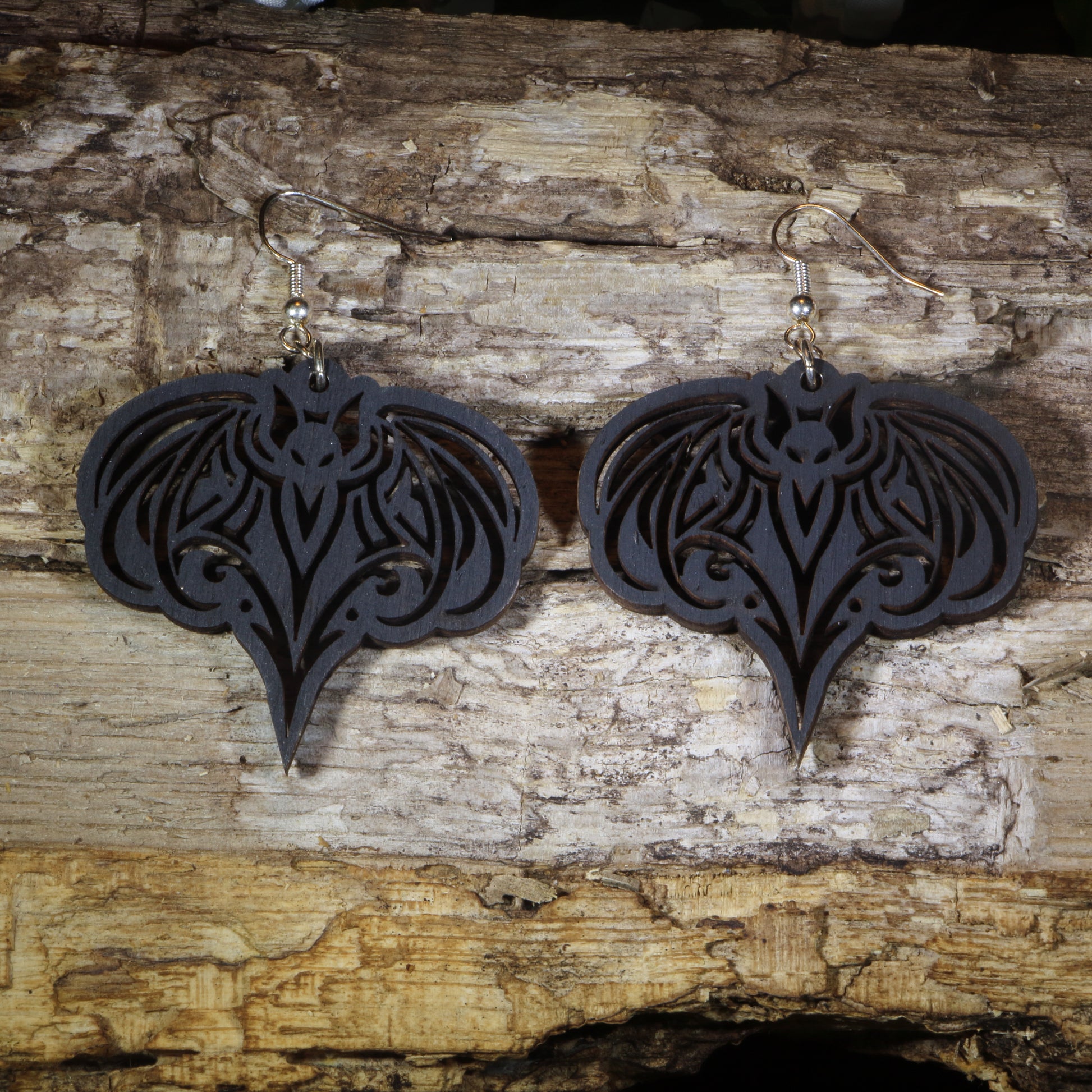 Hand-painted wooden gothic bat dangle earrings featuring an elegant bat silhouette with intricate details, hypoallergenic sterling silver hooks, and lightweight gothic Halloween jewelry for bat lovers, spooky season fans, and alternative fashion enthusiasts by Cate's Concepts.