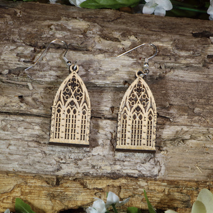 Hand-painted wooden gothic window dangle earrings featuring intricate cathedral-inspired stained glass window details, hypoallergenic sterling silver hooks, and lightweight gothic jewelry for architecture lovers, fantasy fans, and dark academia enthusiasts by Cate's Concepts.