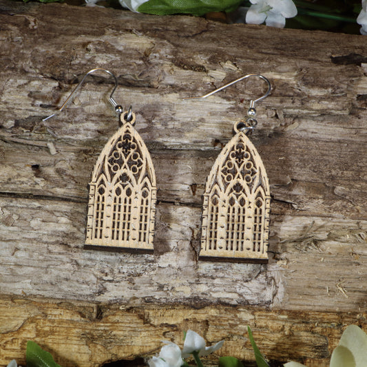 Hand-painted wooden gothic window dangle earrings featuring intricate cathedral-inspired stained glass window details, hypoallergenic sterling silver hooks, and lightweight gothic jewelry for architecture lovers, fantasy fans, and dark academia enthusiasts by Cate's Concepts.