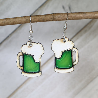 Hand-painted wooden green beer mug dangle earrings with festive St. Patrick’s Day design and hypoallergenic sterling silver hooks, lightweight novelty jewelry for bar crawls and Irish celebrations by Cate’s Concepts
