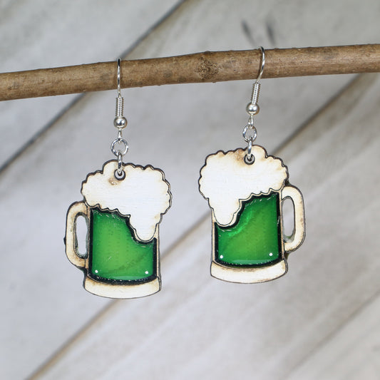 Hand-painted wooden green beer mug dangle earrings with festive St. Patrick’s Day design and hypoallergenic sterling silver hooks, lightweight novelty jewelry for bar crawls and Irish celebrations by Cate’s Concepts
