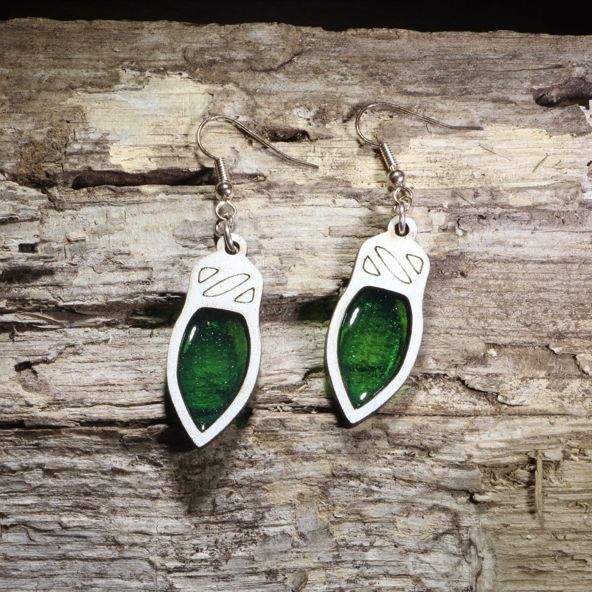 Handcrafted resin green Christmas light wooden dangle earrings featuring colorful holiday light bulbs with glossy resin-filled centers. Lightweight laser-cut wooden earrings with hypoallergenic .925 sterling silver hooks, perfect for Christmas celebrations, holiday parties, festive fashion, Christmas light lovers, and seasonal handmade jewelry.