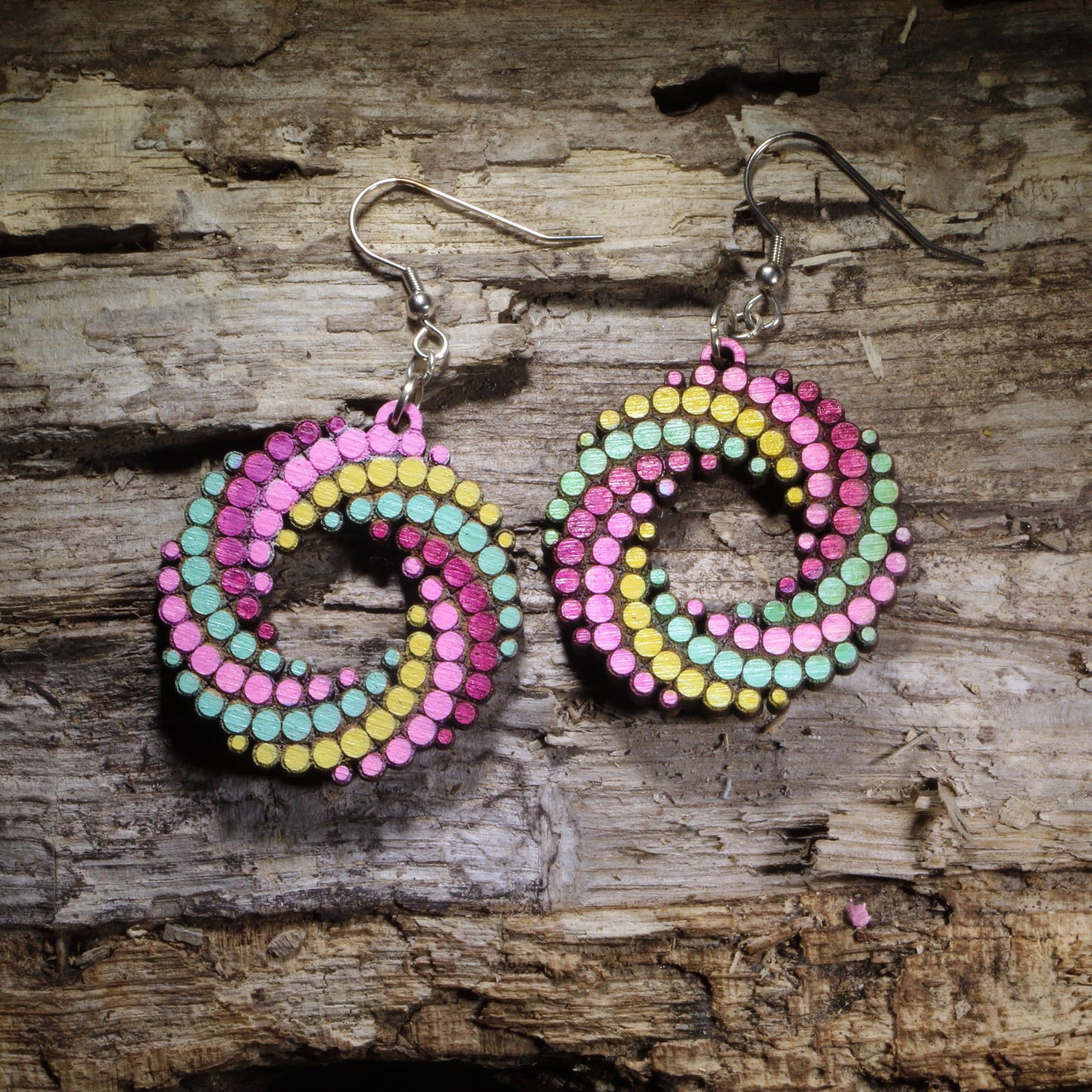 Green, Yellow , Purple Hand-painted colorful dot spiral wooden dangle earrings featuring a bold swirling pattern of colorful dots. Lightweight geometric statement earrings available in multiple color combinations, perfect for art lovers, colorful style, and playful modern outfits.