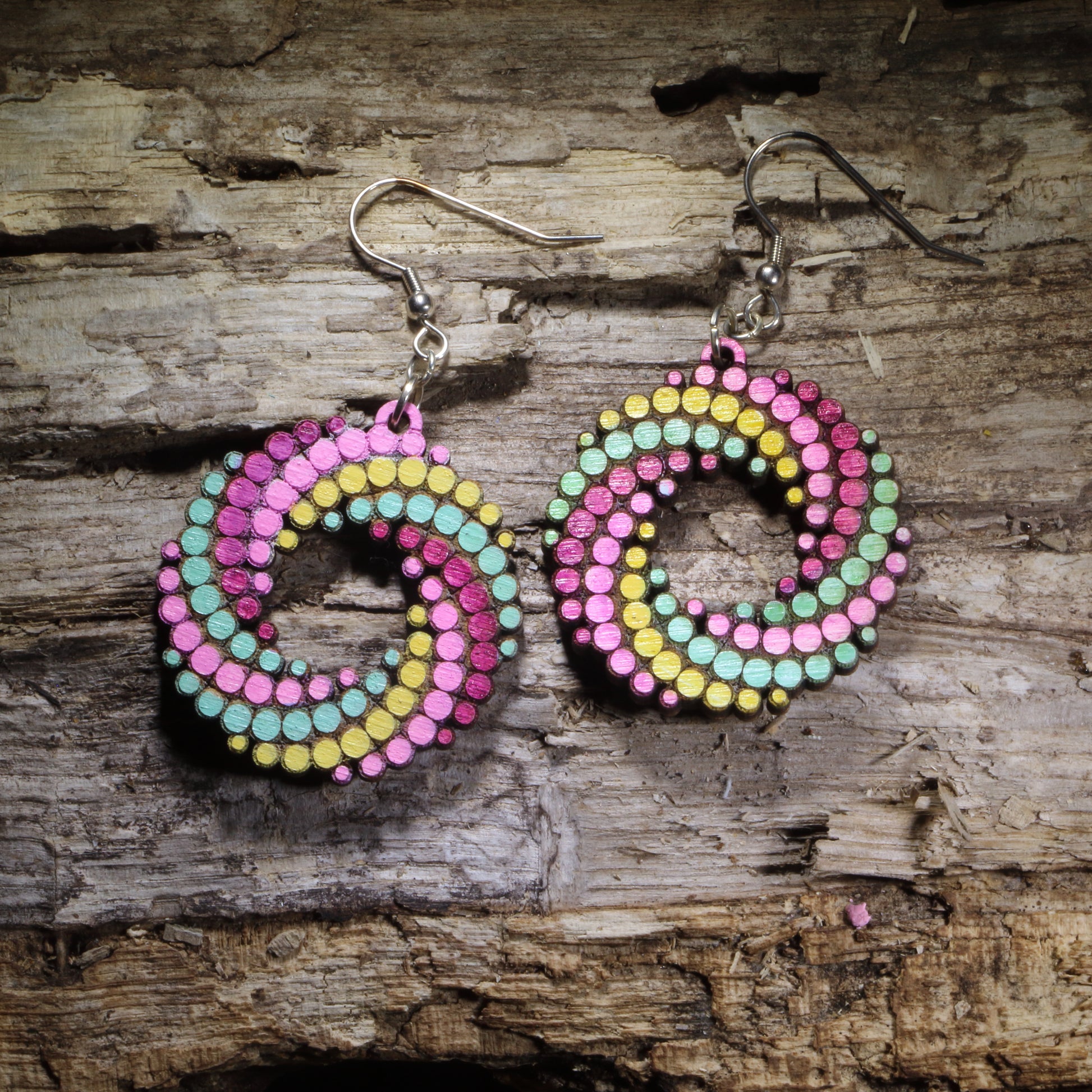 Green, Yellow , Purple Hand-painted colorful dot spiral wooden dangle earrings featuring a bold swirling pattern of colorful dots. Lightweight geometric statement earrings available in multiple color combinations, perfect for art lovers, colorful style, and playful modern outfits.