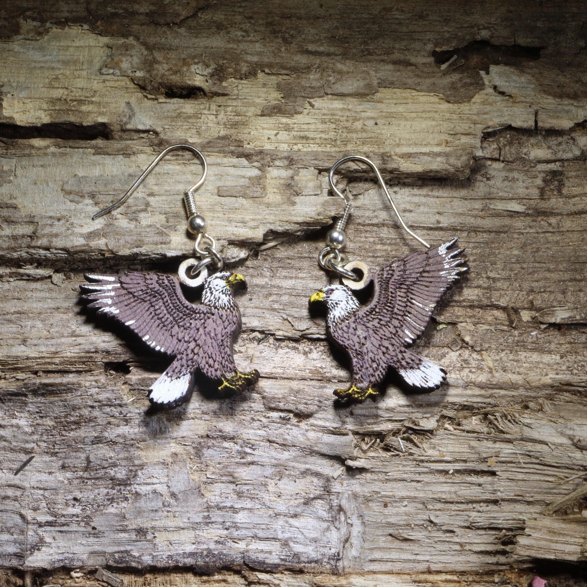 Hand-painted Bald Eagle wooden dangle earrings featuring the iconic American eagle in a lightweight wildlife design. Perfect for bird lovers, eagle enthusiasts, patriotic celebrations, veterans, and anyone who loves American wildlife jewelry.