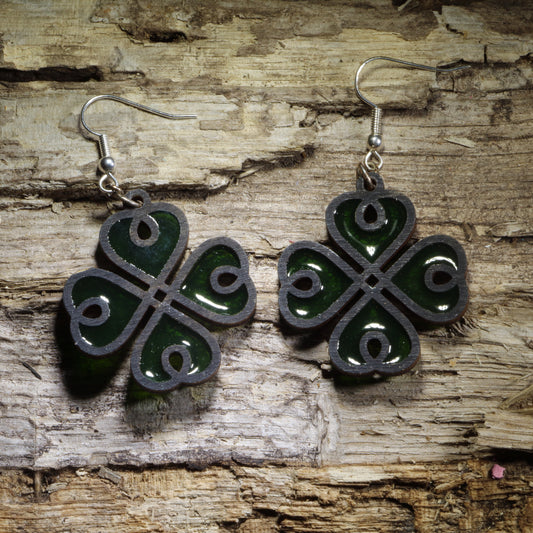 Hand-painted Resin Shamrock wooden dangle earrings featuring a four-leaf clover design with rich green resin accents. Lightweight and eye-catching, they’re perfect for St. Patrick’s Day, Irish celebrations, good luck gifts, and shamrock jewelry lovers.