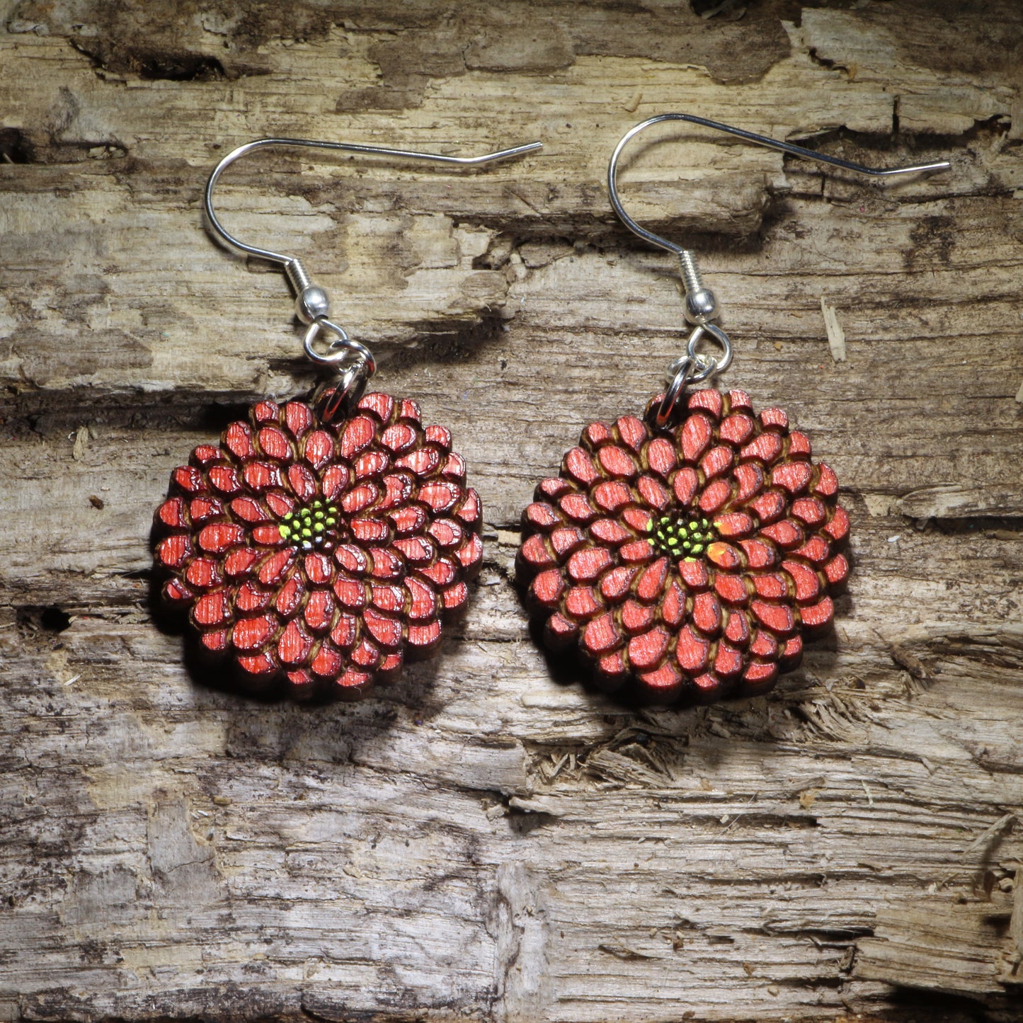 Hand-painted red zinnia wooden dangle earrings featuring a smaller layered flower design with detailed petals and green-yellow center. Lightweight floral earrings with hypoallergenic .925 sterling silver hooks, perfect for gardeners, flower lovers, nature enthusiasts, and botanical jewelry gifts.