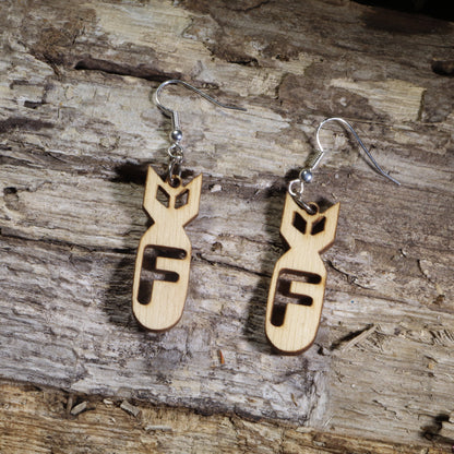  Hand-painted wooden F-bomb dangle earrings featuring a stylized cartoon bomb with a bold cutout letter "F" on hypoallergenic .925 sterling silver hooks. Lightweight novelty earrings perfect for sarcastic humor, edgy fashion, gag gifts, and fans of witty statement jewelry.