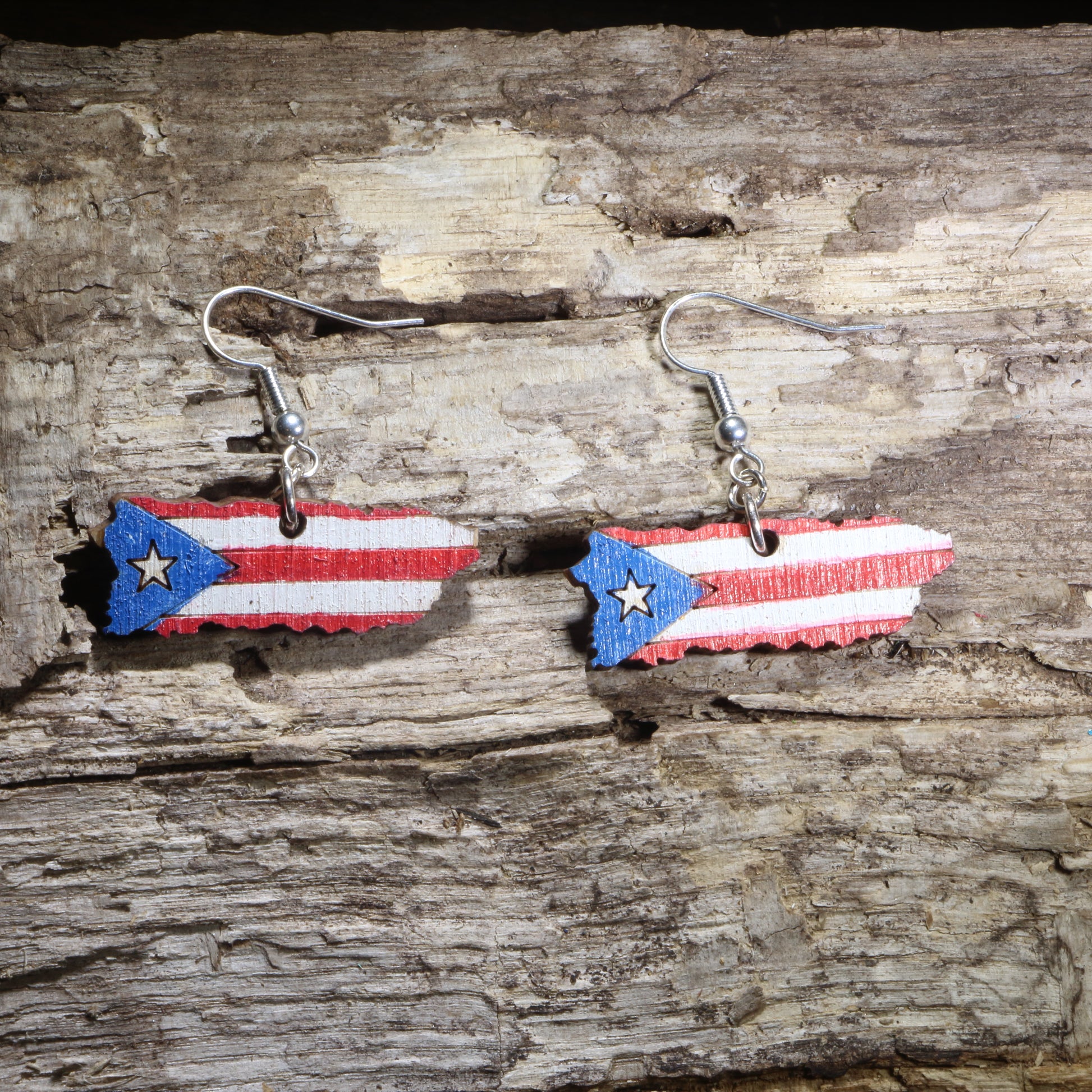 Hand-painted wooden Puerto Rico island dangle earrings featuring the Puerto Rican flag on hypoallergenic .925 sterling silver hooks. Lightweight Puerto Rico jewelry for Boricua pride, Puerto Rican heritage, cultural celebrations, and island lovers.