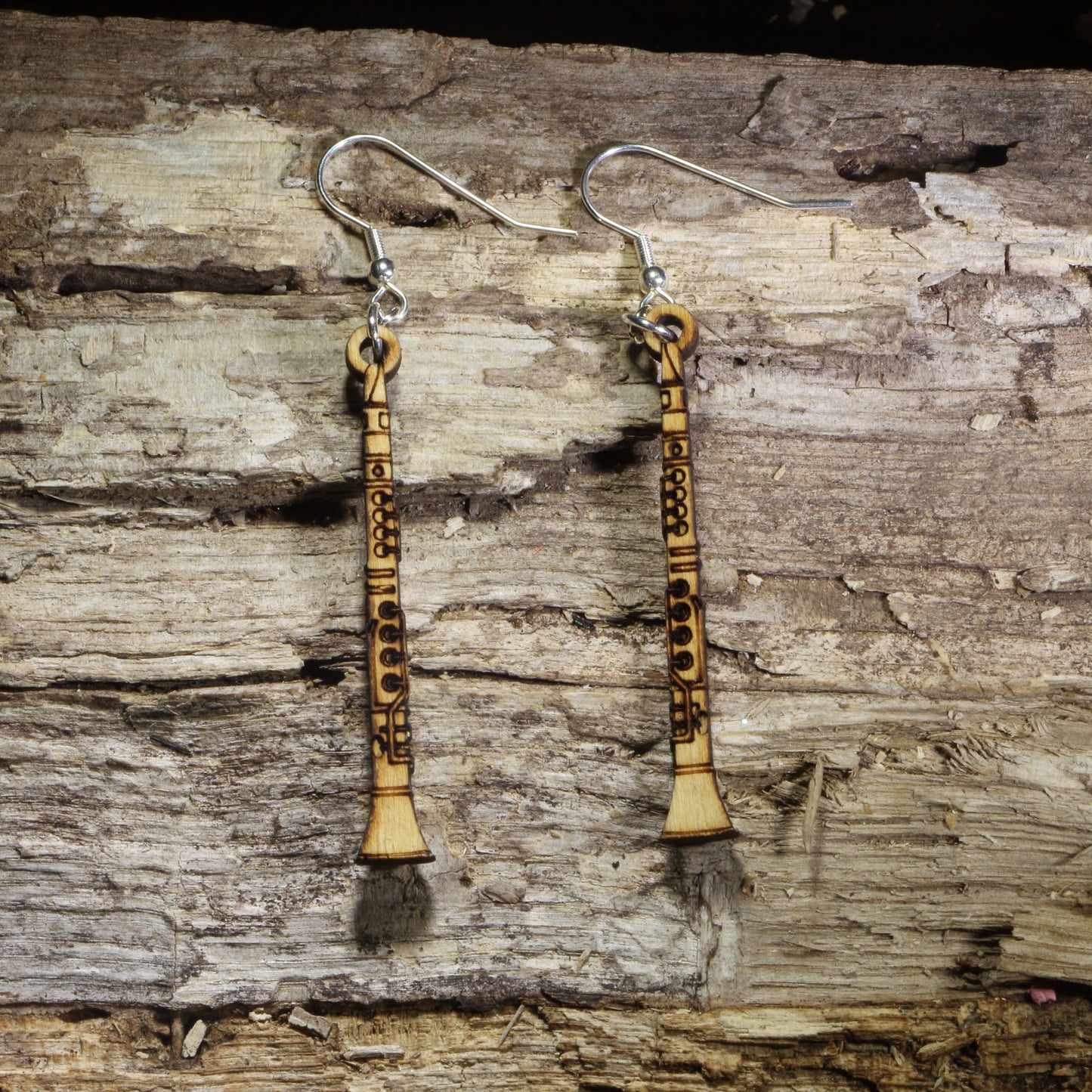 Hand-painted wooden clarinet dangle earrings featuring detailed clarinet engravings on hypoallergenic .925 sterling silver hooks. Lightweight music-inspired jewelry for clarinet players, band members, orchestra musicians, music teachers, and woodwind enthusiasts.