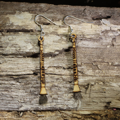 Hand-painted wooden clarinet dangle earrings featuring detailed clarinet engravings on hypoallergenic .925 sterling silver hooks. Lightweight music-inspired jewelry for clarinet players, band members, orchestra musicians, music teachers, and woodwind enthusiasts.