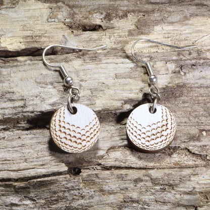 Hand-painted wooden golf ball dangle earrings featuring realistic engraved dimples on hypoallergenic .925 sterling silver hooks. Lightweight golf jewelry for golfers, golf coaches, country club members, tournament gifts, and golf enthusiasts.