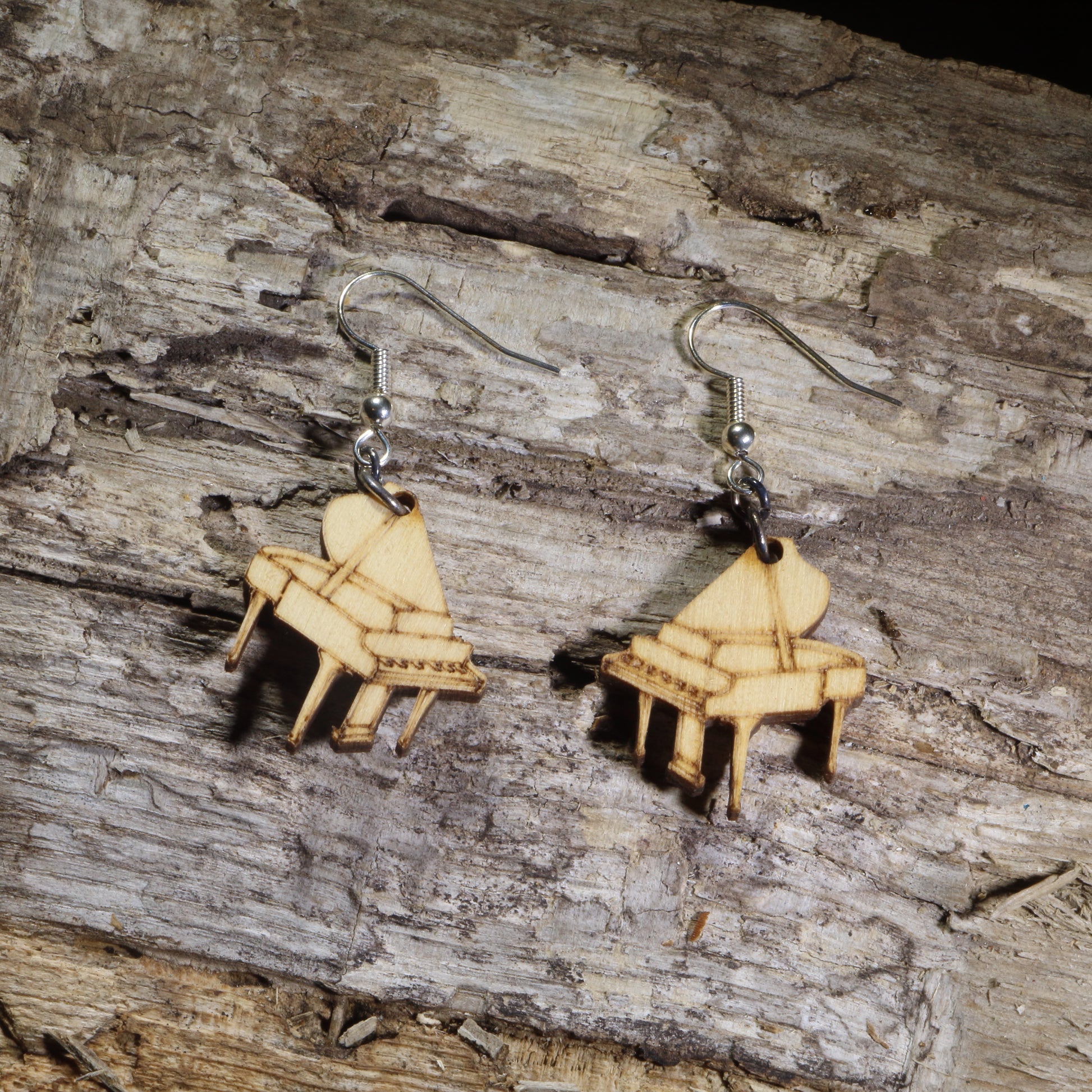 Hand-painted wooden grand piano dangle earrings featuring detailed baby grand pianos on hypoallergenic .925 sterling silver hooks. Lightweight music-inspired jewelry for pianists, piano teachers, musicians, music students, and classical music lovers.
