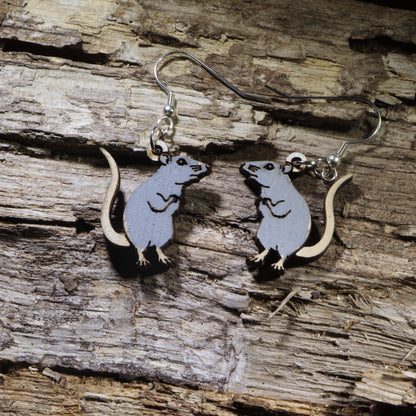 Hand-painted wooden gray rat dangle earrings featuring an adorable standing rat design with a long tail and detailed engraving. Lightweight animal earrings with hypoallergenic .925 sterling silver hooks, perfect for rat lovers, pet rat owners, rodent enthusiasts, wildlife fans, and anyone who loves unique handmade jewelry.