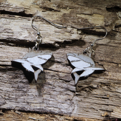 Hand-painted wooden great white shark dangle earrings featuring a detailed great white shark silhouette with engraved gill and fin accents. Lightweight ocean-inspired earrings with hypoallergenic .925 sterling silver hooks, perfect for shark lovers, marine biology enthusiasts, scuba divers, ocean conservation supporters, beach lovers, and anyone who loves unique handmade sea life jewelry.