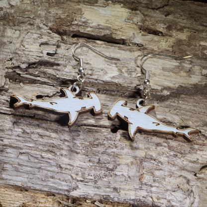 Hand-painted wooden hammerhead shark dangle earrings on hypoallergenic .925 sterling silver hooks. Lightweight ocean jewelry for shark lovers, marine biologists, scuba divers, beach enthusiasts, and sea life fans.