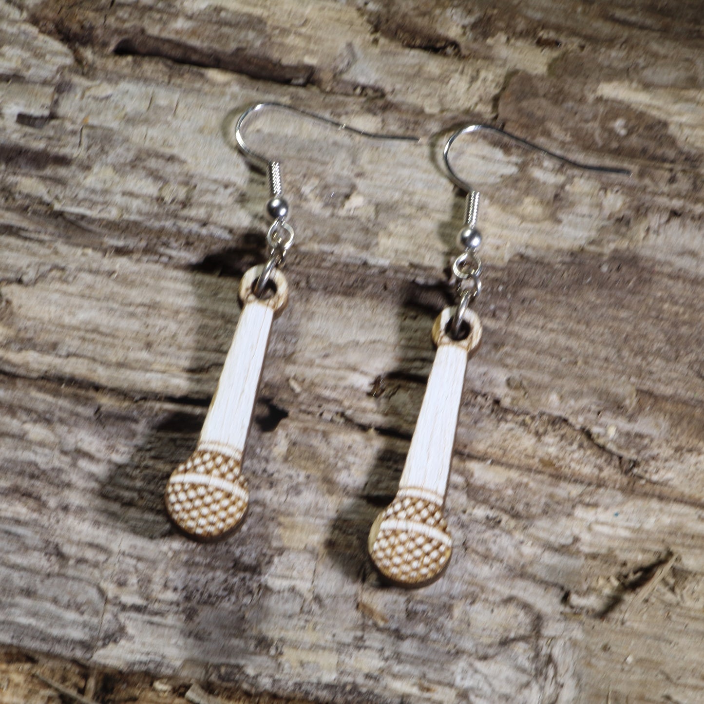Hand-painted wooden handheld microphone dangle earrings with engraved microphone grille details on hypoallergenic .925 sterling silver hooks. Lightweight music jewelry perfect for singers, vocalists, karaoke enthusiasts, podcasters, and music lovers.