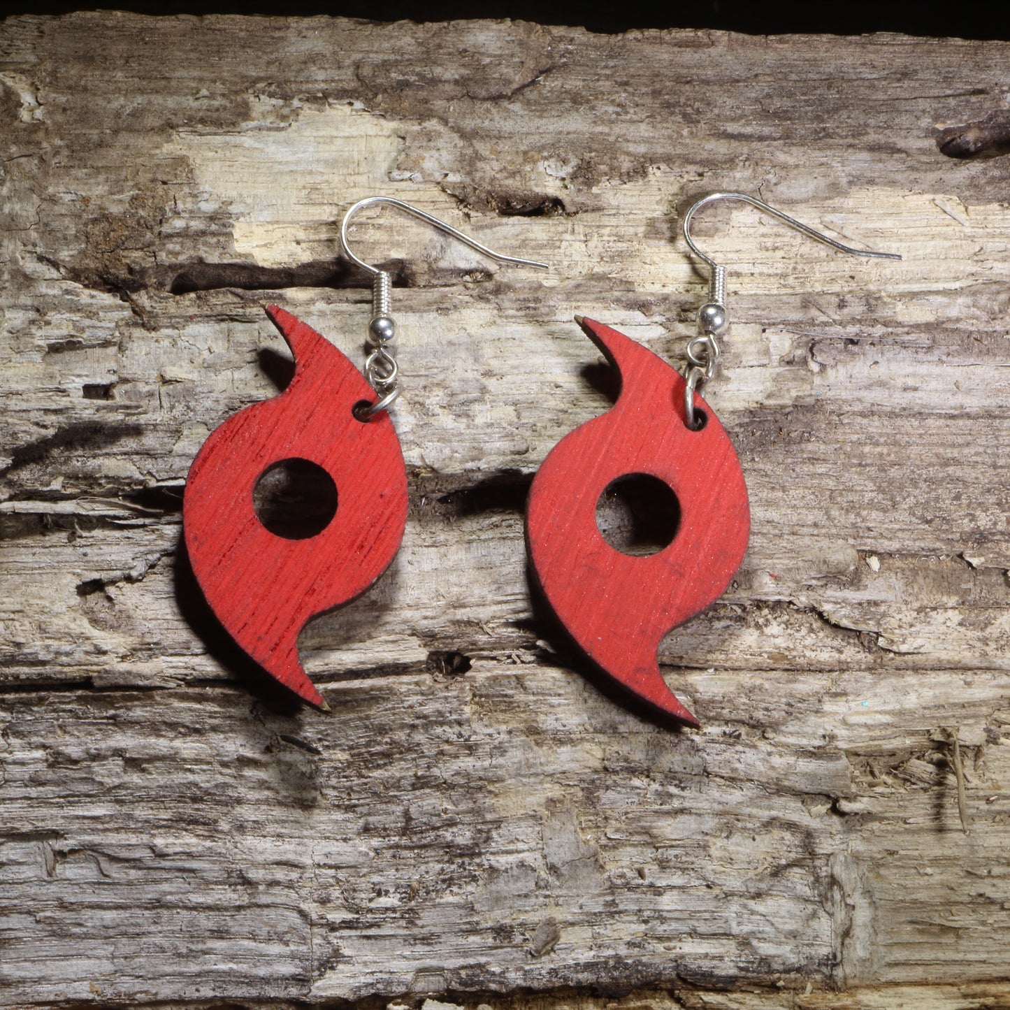 Hand-painted wooden hurricane symbol dangle earrings featuring a bold red tropical cyclone design on hypoallergenic .925 sterling silver hooks. Lightweight weather-inspired jewelry for storm chasers, meteorologists, hurricane enthusiasts, and unique science-themed accessories.
