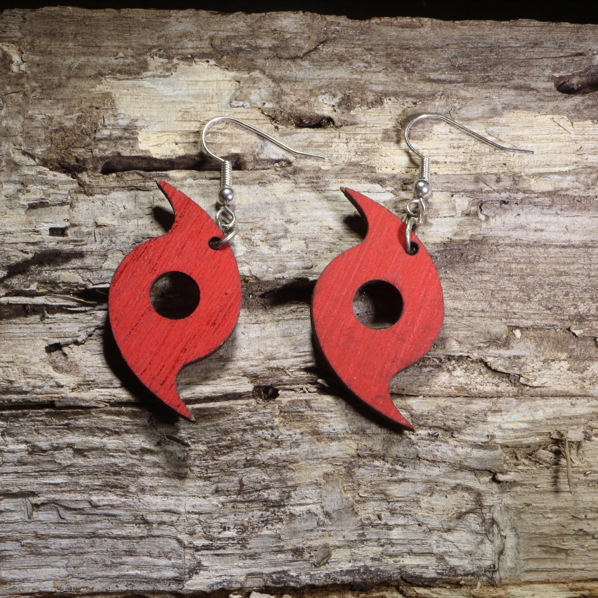 Hand-painted wooden hurricane symbol dangle earrings featuring a bold red tropical cyclone design on hypoallergenic .925 sterling silver hooks. Lightweight weather-inspired jewelry for storm chasers, meteorologists, hurricane enthusiasts, and unique science-themed accessories.