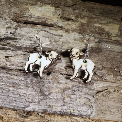 Hand-painted wooden lamb dangle earrings on hypoallergenic .925 sterling silver hooks. Lightweight farm animal jewelry for sheep lovers, shepherds, farmers, Easter celebrations, and country life enthusiasts.