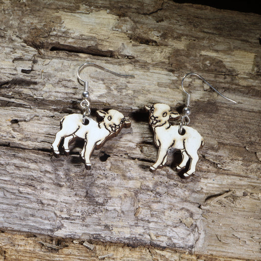 Hand-painted wooden lamb dangle earrings on hypoallergenic .925 sterling silver hooks. Lightweight farm animal jewelry for sheep lovers, shepherds, farmers, Easter celebrations, and country life enthusiasts.