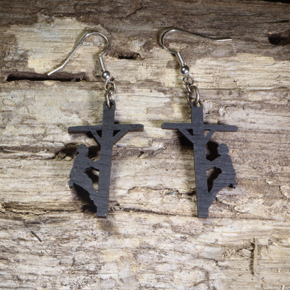 Hand-painted wooden lineman dangle earrings featuring a utility worker climbing a power pole silhouette on lightweight wood with hypoallergenic .925 sterling silver hooks. Perfect for linemen, electrical utility workers, power company employees, electricians, apprentices, and meaningful trade profession jewelry.