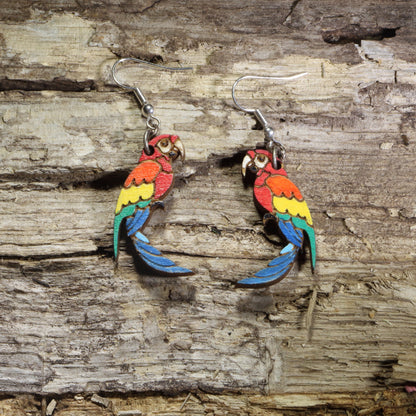Hand-painted wooden parrot dangle earrings featuring colorful tropical parrots with red, orange, yellow, green, and blue feathers on hypoallergenic .925 sterling silver hooks. Lightweight bird jewelry perfect for parrot lovers, tropical wildlife enthusiasts, and colorful nature-inspired style.