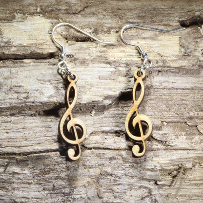 Hand-painted wooden treble clef dangle earrings featuring the classic treble clef music symbol on hypoallergenic .925 sterling silver hooks. Lightweight music jewelry for pianists, singers, choir members, band and orchestra musicians, music teachers, composers, and lovers of musical notation.