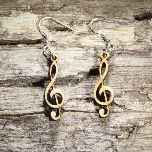 Hand-painted wooden treble clef dangle earrings featuring the classic treble clef music symbol on hypoallergenic .925 sterling silver hooks. Lightweight music jewelry for pianists, singers, choir members, band and orchestra musicians, music teachers, composers, and lovers of musical notation.