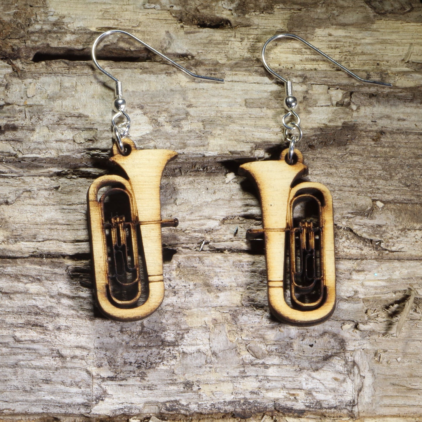 Hand-painted wooden tuba dangle earrings featuring detailed concert tubas with engraved brass instrument accents on hypoallergenic .925 sterling silver hooks. Lightweight music jewelry for tuba players, band directors, marching band members, orchestra musicians, music teachers, and brass instrument enthusiasts.